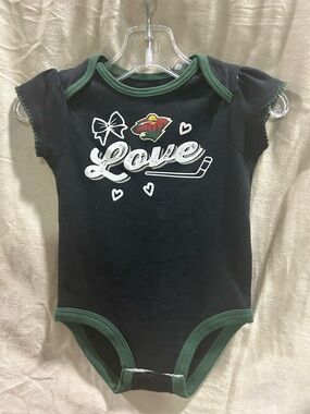 NHL Black Onesie with Green Ribbed Collar and Team Graphic